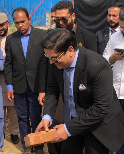 CEO Syed M. Abbas Zaidi laying First Brick